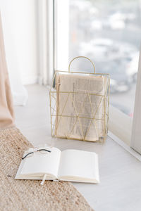 Close-up of open book on table at home