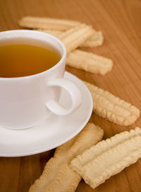 Close-up of coffee and french fries on table