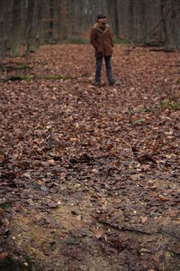 Full length of a woman standing in autumn