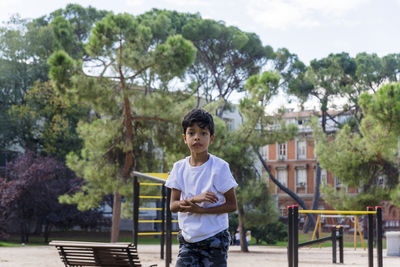 Young boy alone. having fun in a park.