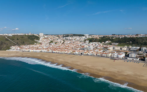 Nazare town in portugal. beach and cityscape. drone point of view.