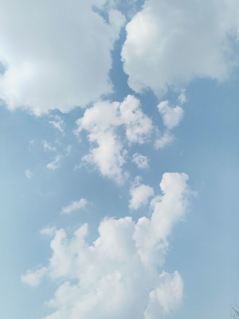 LOW ANGLE VIEW OF CLOUDS IN BLUE SKY