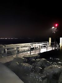 Scenic view of snow against sky at night