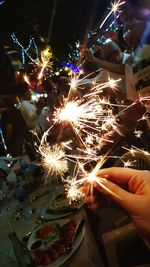 Low angle view of firework display at night