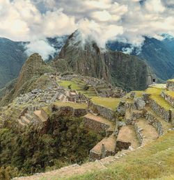 Aerial view of machu pichu against cloudy sky