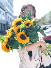 Young woman holding bouquet