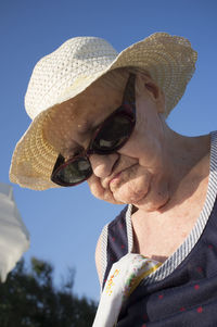 Low angle view of senior woman wearing hat