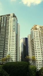 Tall buildings in city against sky