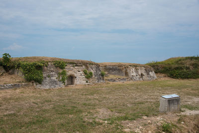 Built structure on land against sky