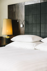 Electric lamp on bed at home