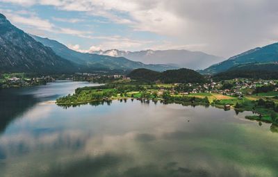 Scenic view of lake and mountains against sky