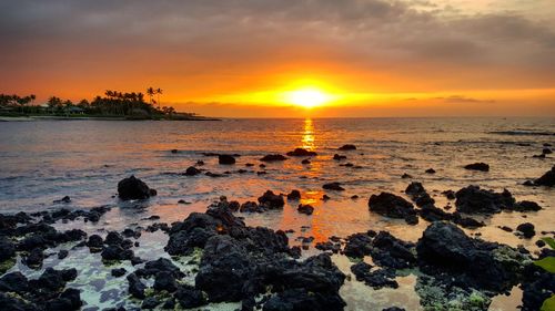 Scenic view of sea against sky during sunset