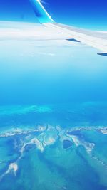 Aerial view of sea and landscape against sky