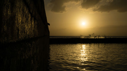 Scenic view of sea at sunset