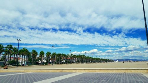 View of empty road against cloudy sky