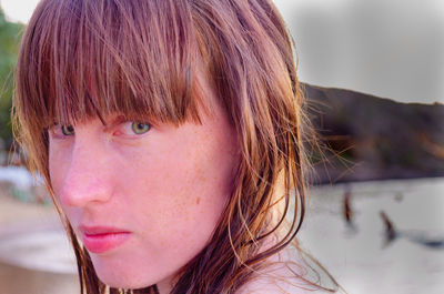 Close-up portrait of woman at beach