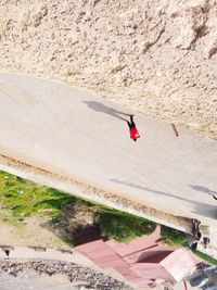 Man jumping on sand