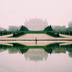 Reflection of historic building in river