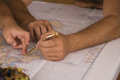 High angle view of man working on table