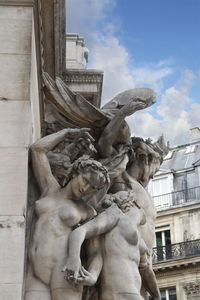 Low angle view of statue against building