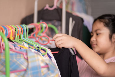 Midsection of boy wearing multi colored store