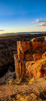 Rock formations on landscape against sky