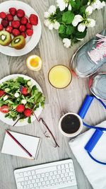 Directly above view of food and sports shoes on table