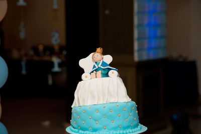 Close-up of figurine on cake