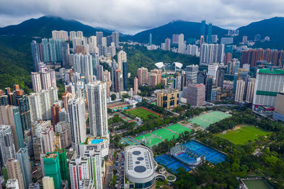 High angle view of modern buildings in city against sky