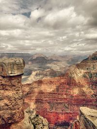 Scenic view of mountains against cloudy sky