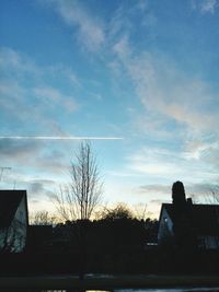 Low angle view of built structure against sky at sunset