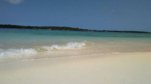 Scenic view of beach against clear sky