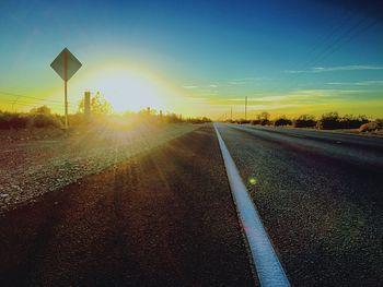 Empty road at sunset