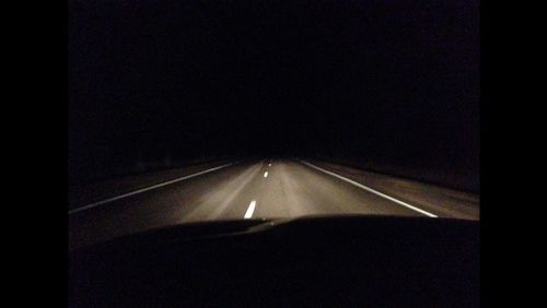 Cars on road at night