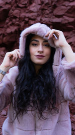 Portrait of young woman wearing hooded jacket