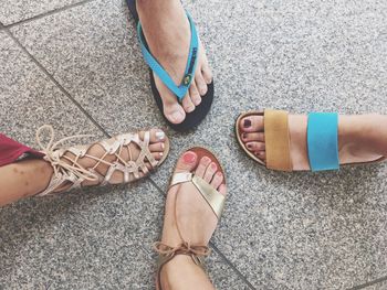 Low section of females wearing footwear