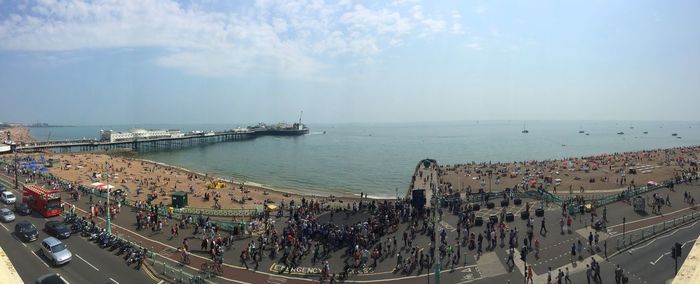 High angle view of crowd by sea against sky