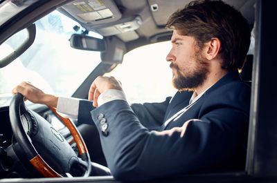 Man sitting in car