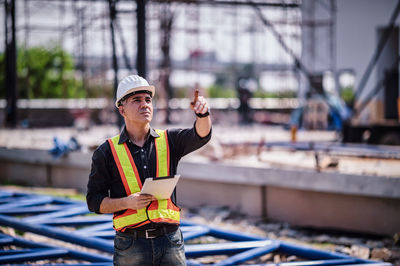 Portrait of man working at construction site