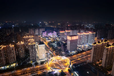 High angle view of illuminated cityscape at night