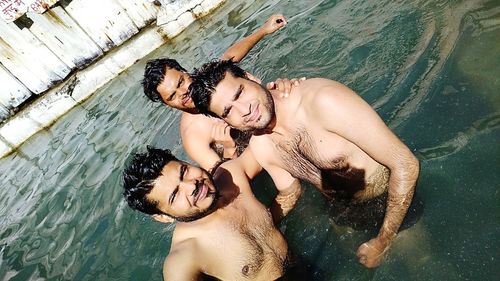 Young couple kissing in swimming pool