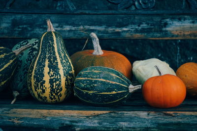 Close-up of pumpkins on wooden table