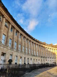 Low angle view of building against cloudy sky