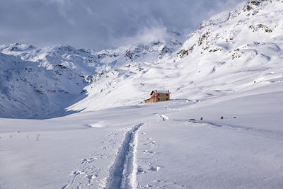 Scenic view of snowcapped mountains against sky