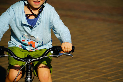 Close-up of woman riding bicycle