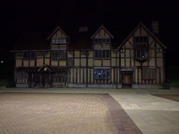 Houses in city at night