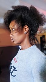 A closed up facial portrait african lady with weaved hair 