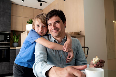 Father and son happy family morning breakfast home