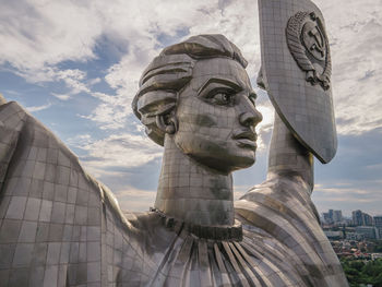 Low angle view of statue against cloudy sky