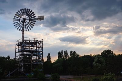 Low angle view of ferris wheel against sky